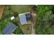 An aerial view shows the house, shed, and surrounding yard including mature trees and other nearby homes at 2824 Wyncote Drive, Raleigh, NC 27603