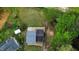 Aerial view of the house, shed, and surrounding property including mature trees and nearby homes at 2824 Wyncote Drive, Raleigh, NC 27603