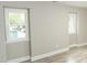 Bright basement with natural light showcasing wood-look vinyl flooring and freshly painted walls at 2824 Wyncote Drive, Raleigh, NC 27603