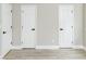 Basement area featuring modern flooring, crisp paint, and multiple doors offering flexible space and functionality at 2824 Wyncote Drive, Raleigh, NC 27603