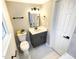 Charming bathroom featuring a vanity with modern fixtures, updated lighting, and elegant, space-saving design at 2824 Wyncote Drive, Raleigh, NC 27603