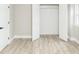 Walk-in closet with open double doors, providing easy access and ample storage space, complemented by modern flooring at 2824 Wyncote Drive, Raleigh, NC 27603
