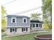 Charming home featuring brick and light gray siding, black shutters, and a well-maintained front yard at 2824 Wyncote Drive, Raleigh, NC 27603