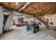 Basement with concrete floors, exposed ceiling, and storage for kayaks and recreational vehicles at 2931 Western Hills Ln, Elon, NC 27244