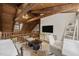 Bright bedroom with exposed beams, work area, and view from a mezzanine at 2931 Western Hills Ln, Elon, NC 27244