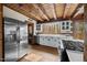 Bright kitchen with white cabinets, stainless steel appliances, and a view of the outdoors at 2931 Western Hills Ln, Elon, NC 27244