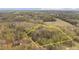 Aerial shot of property with outline showcasing land and home in a natural, wooded setting at 2931 Western Hills Ln, Elon, NC 27244