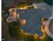 Birds eye view of a grand home featuring a cozy outdoor patio, seating areas, and a well-manicured lawn at 3016 Allansford Ln, Raleigh, NC 27613