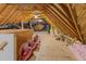 Unfinished attic with exposed beams, insulation and storage at 3016 Allansford Ln, Raleigh, NC 27613