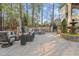 Serene backyard retreat with a hot tub, stone fountain, and comfortable outdoor seating at 3016 Allansford Ln, Raleigh, NC 27613