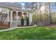 Lush backyard featuring a covered deck and outdoor space with privacy from mature trees at 3016 Allansford Ln, Raleigh, NC 27613