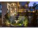 Picturesque backyard featuring a tranquil fountain, lush greenery, and a cozy outdoor seating area at 3016 Allansford Ln, Raleigh, NC 27613