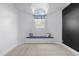 Charming bedroom nook with a window seat, decorative pillows, and an arched window providing natural light at 3016 Allansford Ln, Raleigh, NC 27613