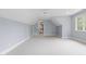 Bonus room features neutral paint, carpet, and natural light at 3016 Allansford Ln, Raleigh, NC 27613