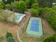 Aerial view of the community pool, cabana, and tennis court provides endless opportunities for outdoor fun and recreation at 3016 Allansford Ln, Raleigh, NC 27613
