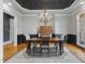 Elegant dining room with hardwood floors, decorative ceiling, and traditional furniture at 3016 Allansford Ln, Raleigh, NC 27613