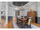 Elegant dining room featuring a statement ceiling, chandelier, hardwood floors and a classic rug at 3016 Allansford Ln, Raleigh, NC 27613