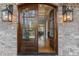 Grand foyer showcasing double doors, hardwood floors, a staircase, and open view to the living spaces at 3016 Allansford Ln, Raleigh, NC 27613