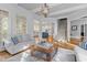 Comfortable living room with hardwood floors, bright windows and view into the kitchen at 3016 Allansford Ln, Raleigh, NC 27613