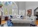 Spacious living room with vaulted ceilings, large windows, hardwood floors, and stylish furnishings at 3016 Allansford Ln, Raleigh, NC 27613
