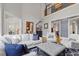 Open concept living room with high ceilings, stylish furniture, hardwood floors, and plenty of natural light at 3016 Allansford Ln, Raleigh, NC 27613