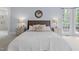 Main bedroom with ceiling fan, sitting area and an ensuite bathroom at 3016 Allansford Ln, Raleigh, NC 27613