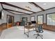Beautiful office with modern desk, chair, and dark wood trim and exposed ceiling beams at 3016 Allansford Ln, Raleigh, NC 27613