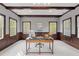 Home office with wood trim, plenty of natural light and a beautiful desk at 3016 Allansford Ln, Raleigh, NC 27613