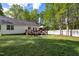 Large backyard and deck are perfect for outdoor activities and relaxation at 304 Westgate Cir, Angier, NC 27501