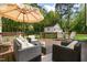 Outdoor patio seating area offers a relaxing space with a patio umbrella at 304 Westgate Cir, Angier, NC 27501