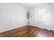 A clean bedroom features hardwood floors, and a decorative tree at 304 Westgate Cir, Angier, NC 27501