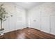 Clean bedroom features hardwood floors, white wainscotting and a closet at 304 Westgate Cir, Angier, NC 27501