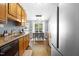 Bright kitchen with stainless steel appliances and an adjacent dining area at 304 Westgate Cir, Angier, NC 27501