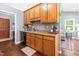 The kitchen features wooden cabinets, wooden floors, and stainless steel sink at 304 Westgate Cir, Angier, NC 27501