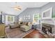 Beautiful living room with a fireplace, hardwood floors, vaulted ceiling, and comfortable sectional at 304 Westgate Cir, Angier, NC 27501