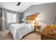 Relaxing primary bedroom with a wooden headboard and neutral decor at 304 Westgate Cir, Angier, NC 27501