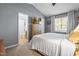 Comfortable main bedroom with a modern design features and en-suite bathroom at 304 Westgate Cir, Angier, NC 27501