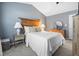 The primary bedroom features a decorative headboard and neutral decor at 304 Westgate Cir, Angier, NC 27501