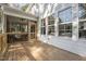Wooden Back Deck with views of a screened porch and the back of the home at 306 White Magnolia Ln, Fuquay Varina, NC 27526
