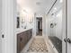 This bathroom features double sinks, a framed mirror, and a glass-enclosed shower at 306 White Magnolia Ln, Fuquay Varina, NC 27526