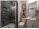 Modern bathroom showcasing a tiled shower, contemporary fixtures, and a sleek vanity with a bright countertop at 306 White Magnolia Ln, Fuquay Varina, NC 27526