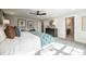 Relax in this bedroom with a ceiling fan, sitting area, and ensuite bathroom at 306 White Magnolia Ln, Fuquay Varina, NC 27526