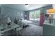 A bedroom with light green walls, white furniture, and wall art creates a comfy and inviting space at 306 White Magnolia Ln, Fuquay Varina, NC 27526