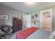 A well decorated bedroom with a sports theme, wooden dresser, and carpet at 306 White Magnolia Ln, Fuquay Varina, NC 27526