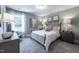 A well decorated bedroom featuring neutral colors, carpet, and wall art at 306 White Magnolia Ln, Fuquay Varina, NC 27526