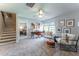 Versatile bonus room featuring carpet, comfortable seating, and adjacent bedroom at 306 White Magnolia Ln, Fuquay Varina, NC 27526