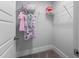 Organized closet with white wire shelving holding clothing, bags, and boxes against a neutral wall at 306 White Magnolia Ln, Fuquay Varina, NC 27526