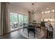 Dining Area leads to a lovely screened porch with views of a wooded setting at 306 White Magnolia Ln, Fuquay Varina, NC 27526