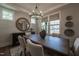 Charming dining room features modern decor, a wooden table, seating for six, and bright windows at 306 White Magnolia Ln, Fuquay Varina, NC 27526