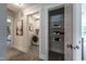 The hallway leads to the laundry room and features a linen closet for added convenience at 306 White Magnolia Ln, Fuquay Varina, NC 27526